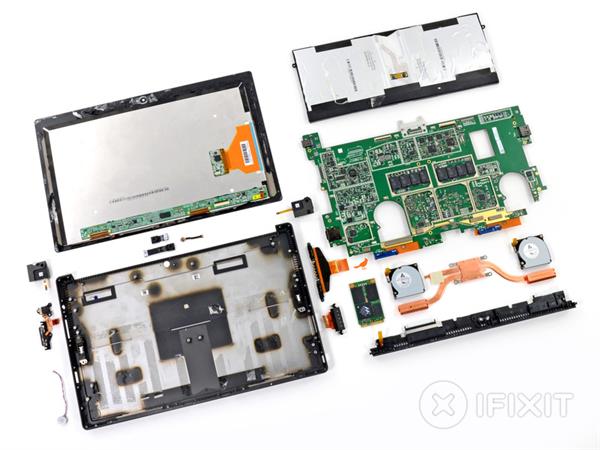 A photo of the parts of a tablet computer laid out.