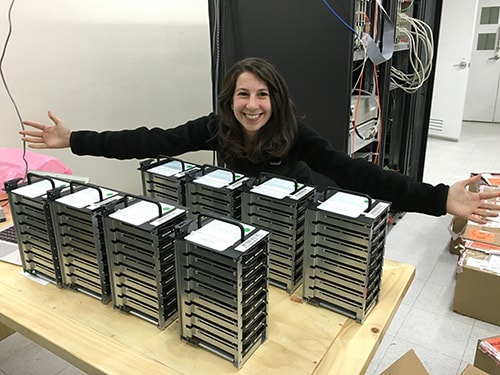 Dr Bouman with the 8 hard drives of data. Dr Bouman with the 8 hard drives of data.